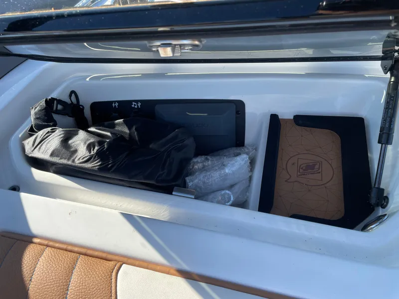 Slide: The Image of Storage compartment in 2021 Nautique Super Air Nautique GS24 boat. - 12