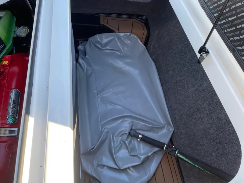 Slide: The Image of Storage compartment in 2021 Nautique Super Air Nautique GS24 boat. - 13