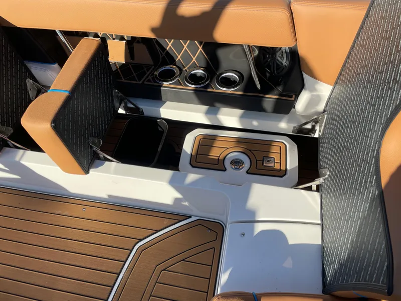 Slide: The Image of Interior of 2021 Nautique Super Air Nautique GS24 with brown seating. - 15
