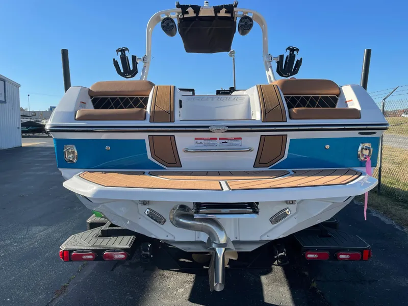 Slide: The Image of Rear view of a 2021 Nautique Super Air Nautique GS24 boat. - 21