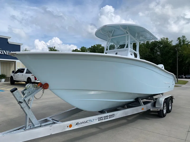 Slide: The Image of 2024 Cape Horn 24 XS boat on a trailer in a parking lot. - 3