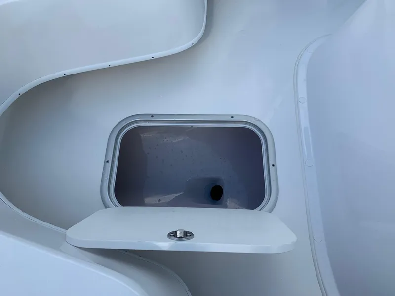 Slide: The Image of Open storage compartment on a 2024 Cape Horn 24 XS boat. - 15