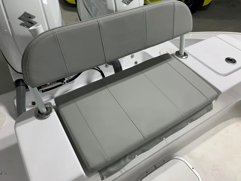 Slide: The Image of 2024 Cape Horn 24 XS boat with gray cushioned seating. - 21