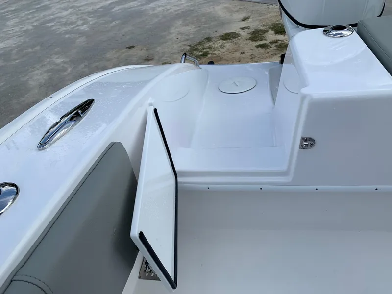 Slide: The Image of 2024 Cape Horn 24 XS boat interior with storage compartment open. - 6