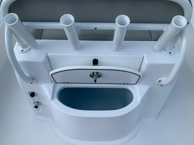 Slide: The Image of 2024 Cape Horn 24 XS boat console with rod holders and storage compartment. - 7