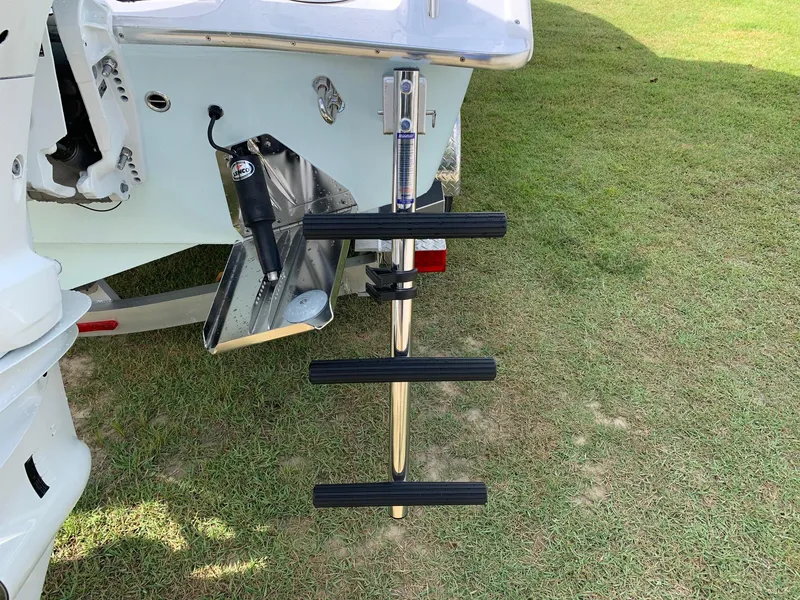 Slide: The Image of 2024 Cape Horn 24 XS boat with a retractable swim ladder. - 18