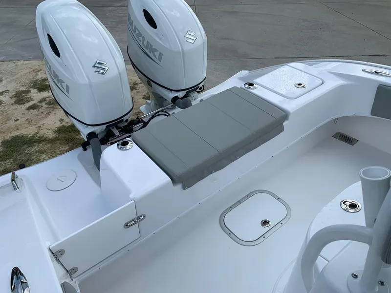 Slide: The Image of 2024 Cape Horn 24 XS boat with dual Suzuki outboard engines and rear seating. - 19