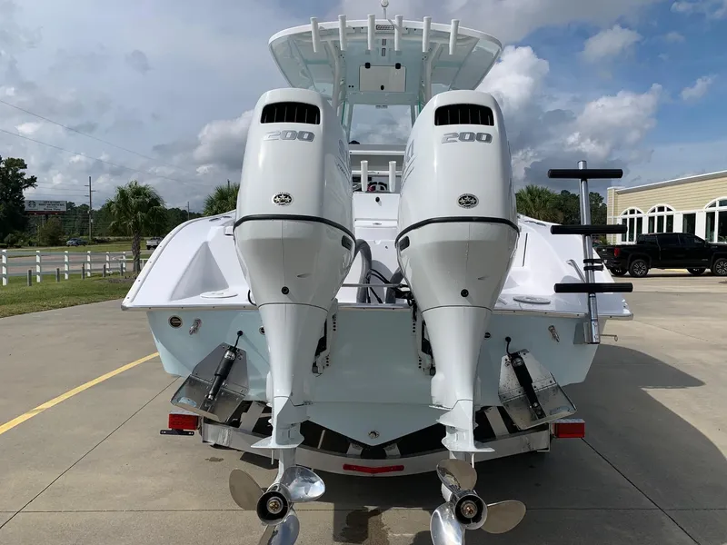 Slide: The Image of 2024 Cape Horn 24 XS boat with twin 200 HP engines, rear view. - 2