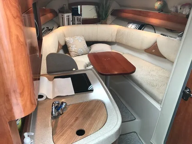 Slide: The Image of 2007 Four Winns 278 Vista cabin interior with kitchenette and cozy seating area. - 10