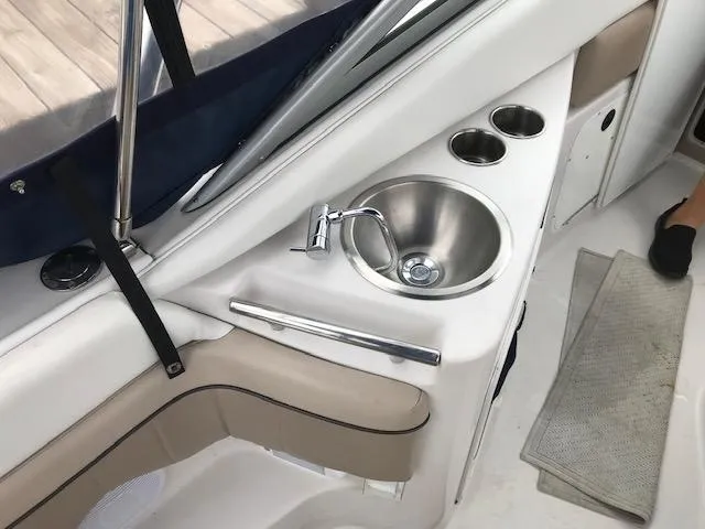 Slide: The Image of 2007 Four Winns 278 Vista boat interior with sink and cup holders. - 7