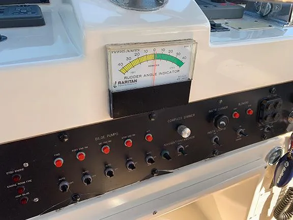 Slide: The Image of Control panel of a 1991 Hatteras 40 Motor Yacht with rudder angle indicator. - 32