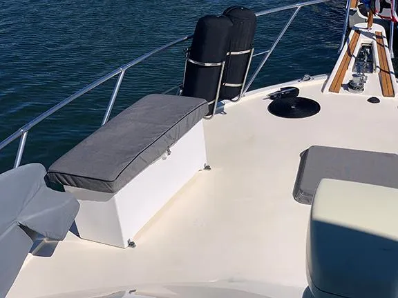 Slide: The Image of 1991 Hatteras 40 Motor Yacht deck with seating and railing. - 36