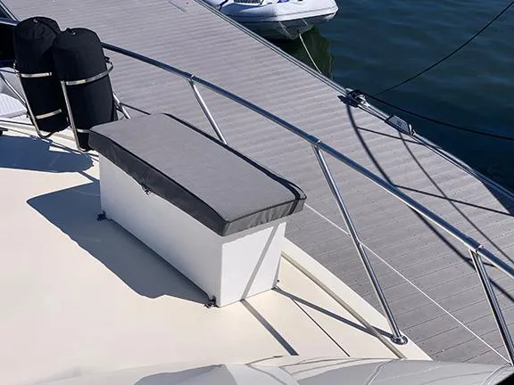 Slide: The Image of Bow deck of 1991 Hatteras 40 Motor Yacht with cushioned seating. - 37