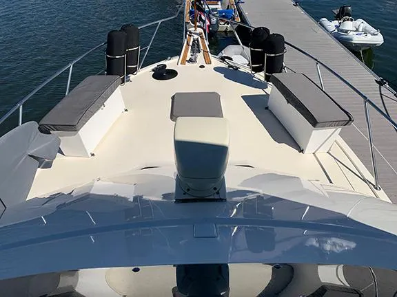 Slide: The Image of 1991 Hatteras 40 Motor Yacht docked, view of the spacious deck and seating area. - 38