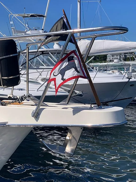 Slide: The Image of 1991 Hatteras 40 Motor Yacht docked with a nautical flag. - 4