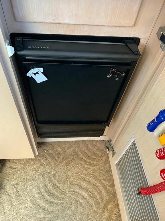 Slide: The Image of Compact refrigerator in the 1991 Hatteras 40 Motor Yacht interior. - 48