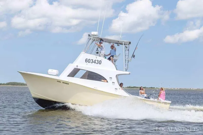 The Image of 1979 Custom Carolina Sportfish 35 cruising on open water. - 0