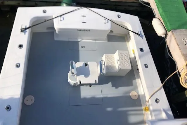 Slide: The Image of 1979 Custom Carolina Sportfish 35 boat deck with fishing chair and storage. - 14