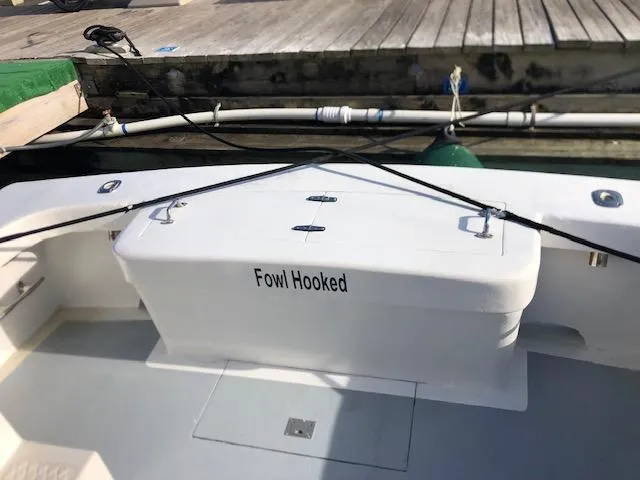 Slide: The Image of 1979 Custom Carolina Sportfish 35 docked, named Fowl Hooked. - 15