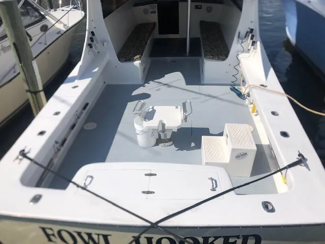 Slide: The Image of 1979 Custom Carolina Sportfish 35 boat with spacious deck and seating. - 3