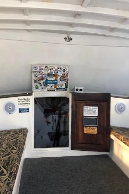 Slide: The Image of Interior of a 1979 Custom Carolina Sportfish 35 boat with storage compartments. - 4