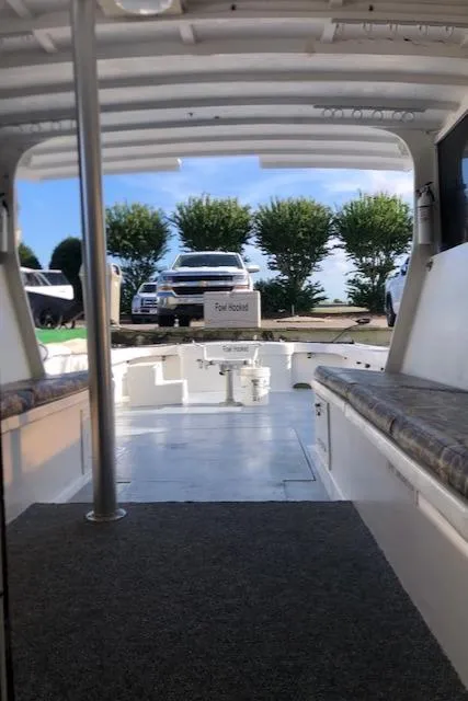 Slide: The Image of 1979 Custom Carolina Sportfish 35 interior view with seating and open deck. - 5