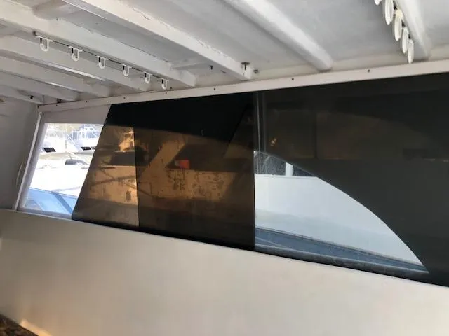 Slide: The Image of 1979 Custom Carolina Sportfish 35 interior view with tinted windows. - 7