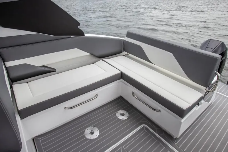 Slide: The Image of 2023 Cruisers Yachts 34 GLS seating area with modern design on the water. - 26