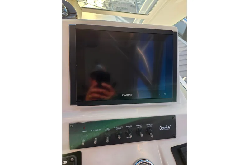 Slide: The Image of Garmin display and control panel on 2007 Carolina Classic 28 Express boat. - 31