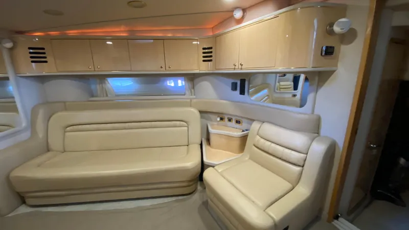Slide: The Image of Luxurious interior of a 2001 Sea Ray 460 Sundancer yacht with beige leather seating. - 17
