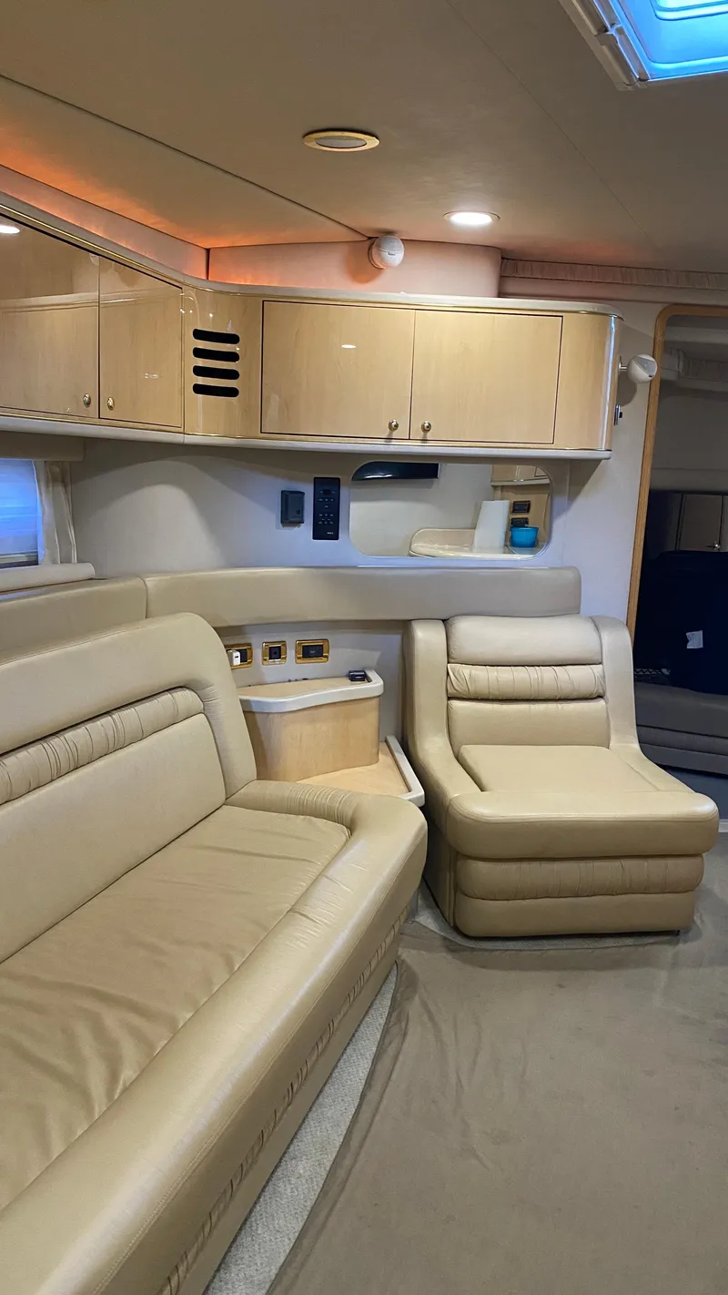 Slide: The Image of Interior of 2001 Sea Ray 460 Sundancer yacht with beige leather seating. - 19