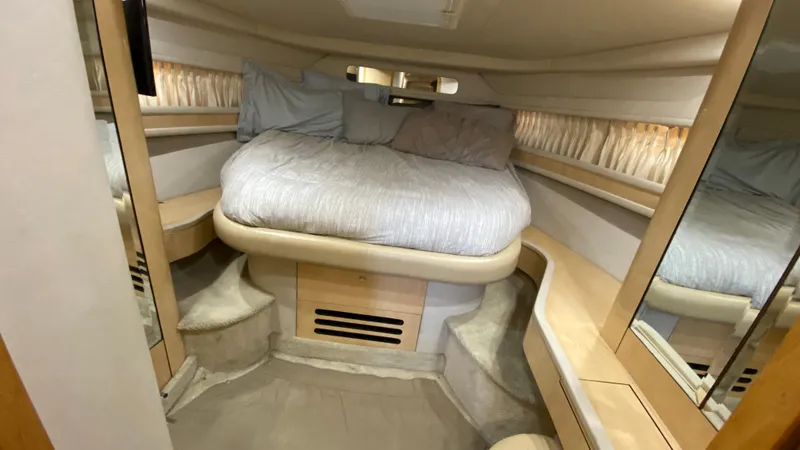 Slide: The Image of 2001 Sea Ray 460 Sundancer cabin with bed and mirrors. - 21
