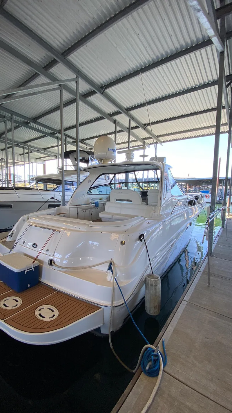 Slide: The Image of 2001 Sea Ray 460 Sundancer yacht docked in a covered marina. - 3