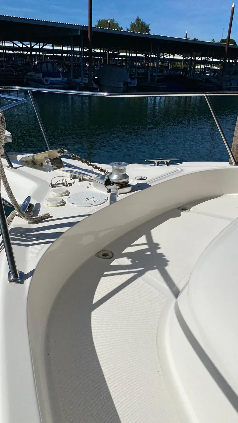 Slide: The Image of 2001 Sea Ray 460 Sundancer yacht bow view at marina. - 36