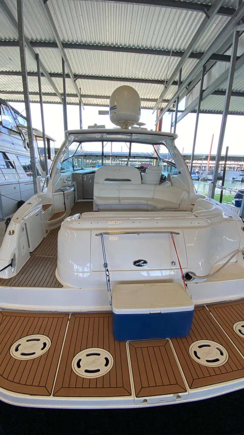 Slide: The Image of 2001 Sea Ray 460 Sundancer yacht docked in a marina. - 5