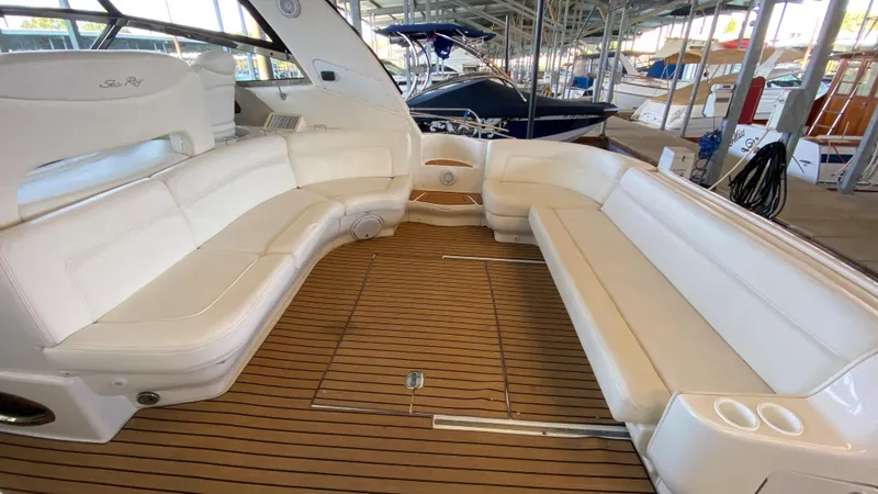 Slide: The Image of 2001 Sea Ray 460 Sundancer boat with spacious seating and teak flooring. - 7