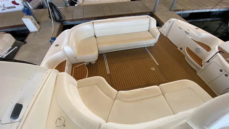 Slide: The Image of 2001 Sea Ray 460 Sundancer boat with spacious seating area and teak flooring. - 9