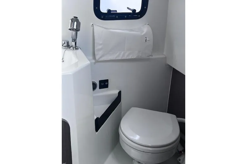 Slide: The Image of 2024 Beneteau Flyer 9 SPACEdeck bathroom with toilet and sink. - 12