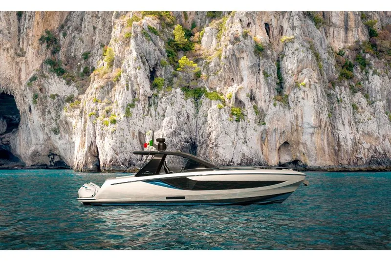 Slide: The Image of 2023 Azimut Verve 42 yacht cruising near rocky cliffs. - 0
