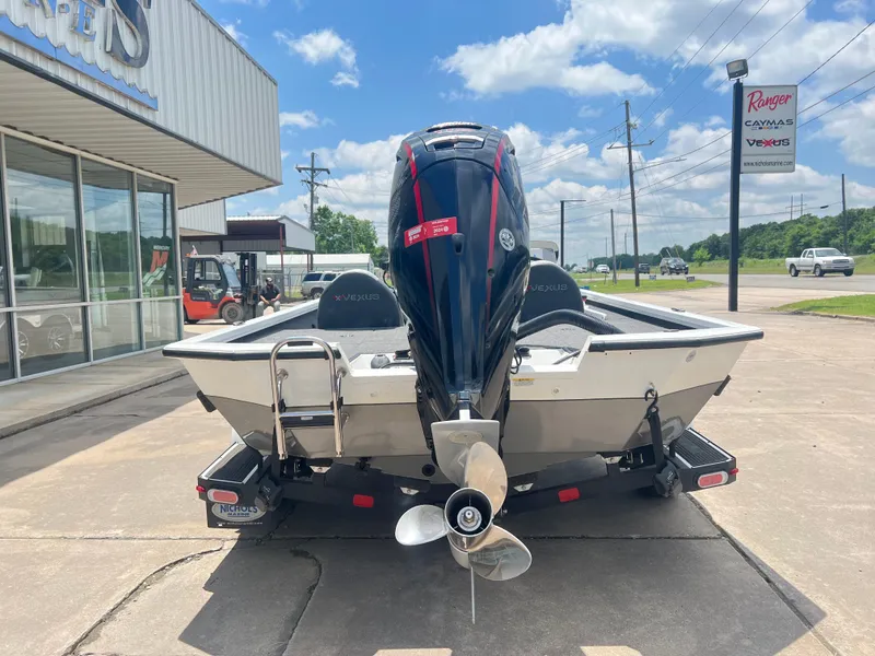 Slide: The Image of 2022 Vexus AVX 1880 boat with outboard motor, displayed outdoors. - 3