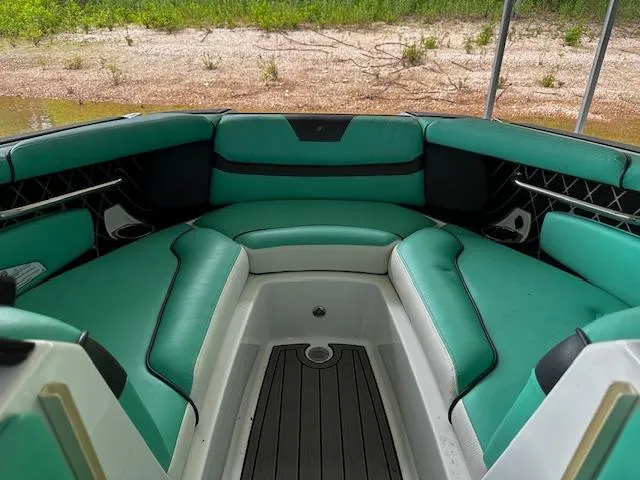 Slide: The Image of 2021 Nautique GS20 boat interior with green and white seating. - 7