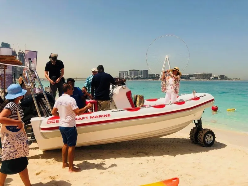 Slide: The Image of People enjoying a 2022 Ocean Craft Marine 7.1 M Amphibious boat on a sunny beach. - 10