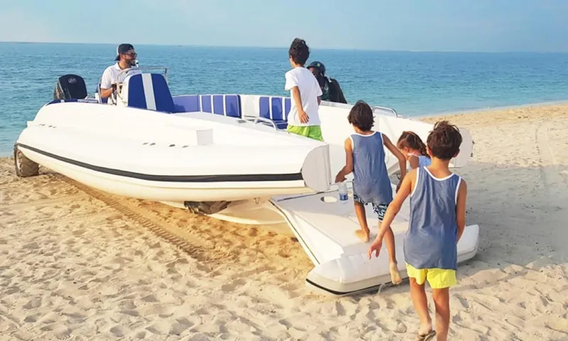 The Image of Family enjoying Ocean Craft Marine 9.5 M Beachlander boat on sandy beach, 2022 model. - 0