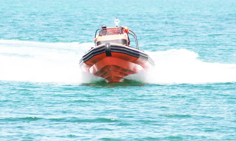 Slide: The Image of 2022 Ocean Craft Marine 9.5M RHIB Professional Search and Rescue boat speeding on water. - 8