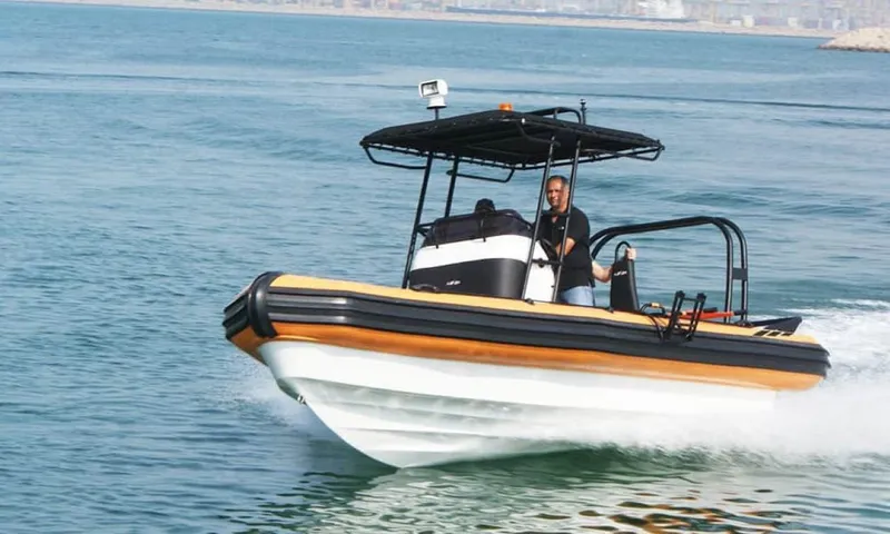 Slide: The Image of 2022 Ocean Craft Marine 9.5M RHIB Professional Search and Rescue boat on water. - 9