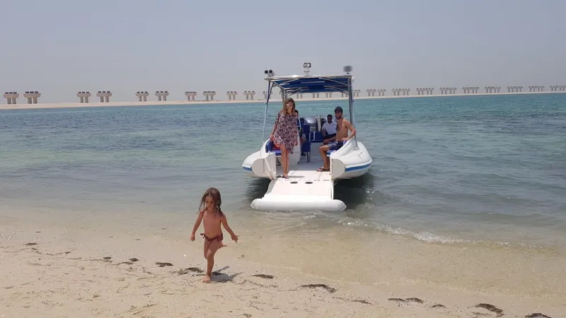 Slide: The Image of Family enjoying a day on the Ocean Craft Marine Beachlander 8.75, 2022 model, at the beach. - 14