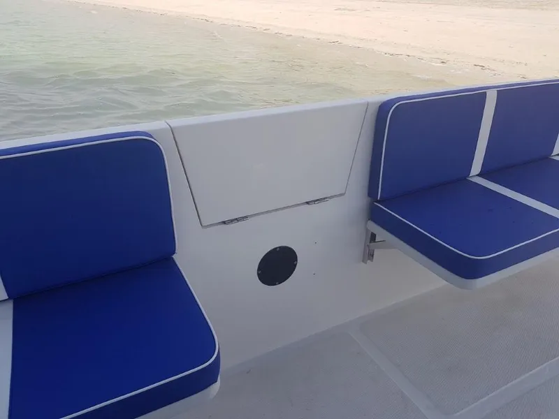 Slide: The Image of Ocean Craft Marine Beachlander 8.75 (2022) boat interior with blue cushioned seats. - 25