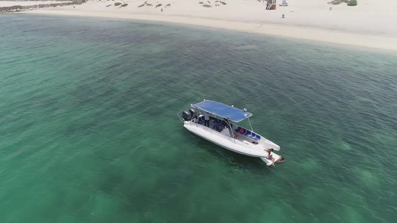 Slide: The Image of 2022 Ocean Craft Marine Beachlander 8.75 boat near sandy beach in clear green water. - 4