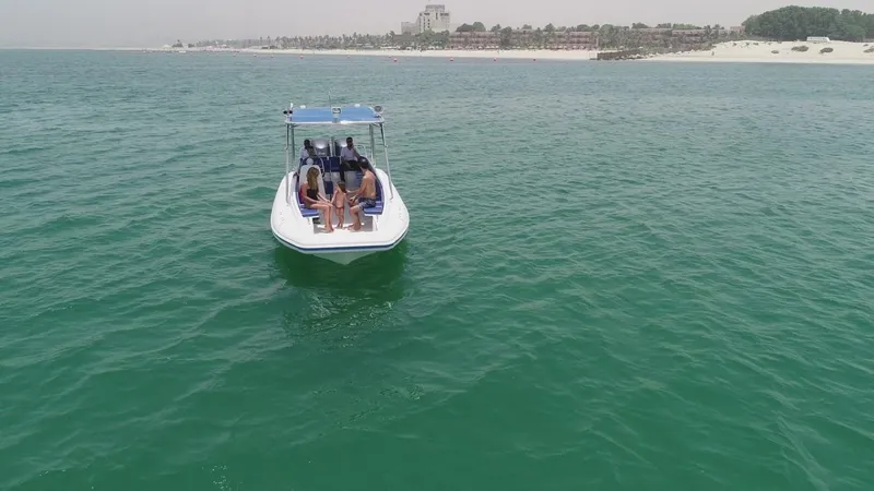 Slide: The Image of 2022 Ocean Craft Marine Beachlander 8.75 boat on open water near a beach. - 6