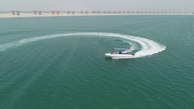 Slide: The Image of Ocean Craft Marine Beachlander 8.75 (2022) making a turn in open water. - 7